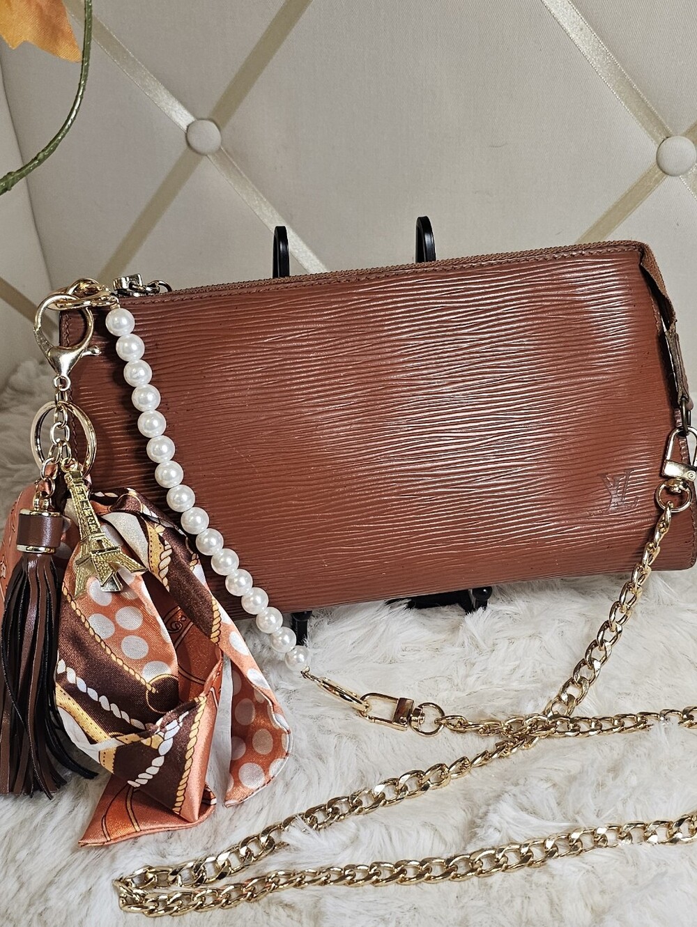 Louis Vuitton Pochette Accessoires crafted in Epi Leather With Unbranded Chain.